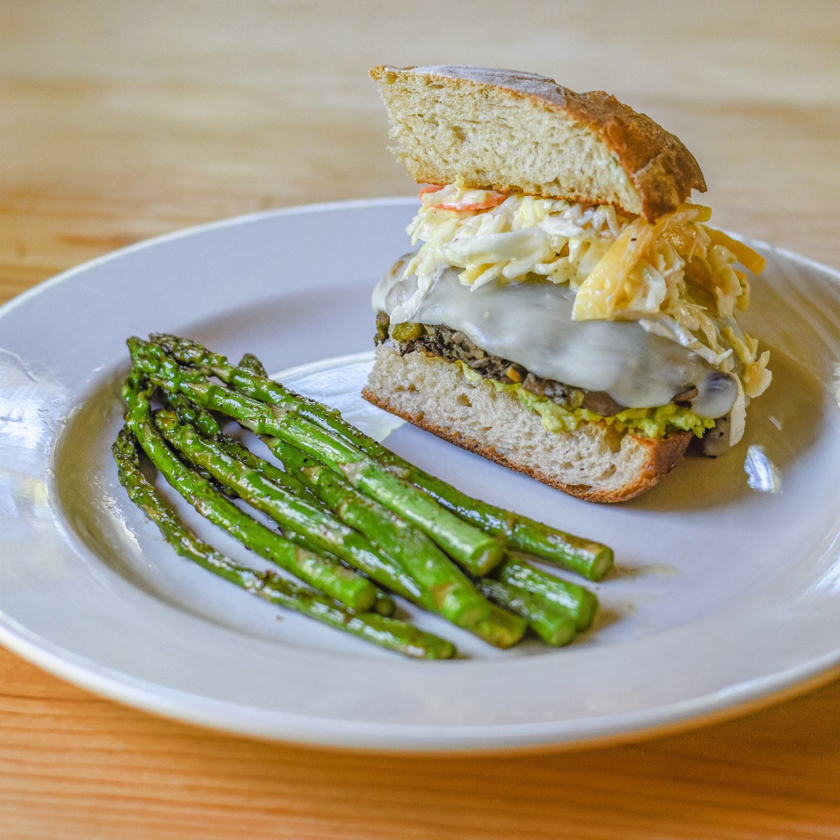 CUBAN-STYLE BLACK BEAN BURGER WITH MANGO CHIPOTLE SLAW + ROASTED ASPARAGUS&nbsp;‘FRIES’