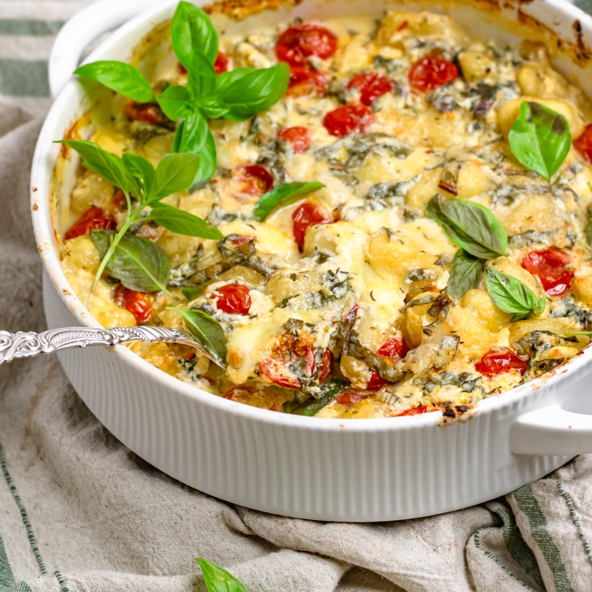 CHEESY BAKED GNOCCHI WITH CHERRY TOMATOES +&nbsp;GREENS